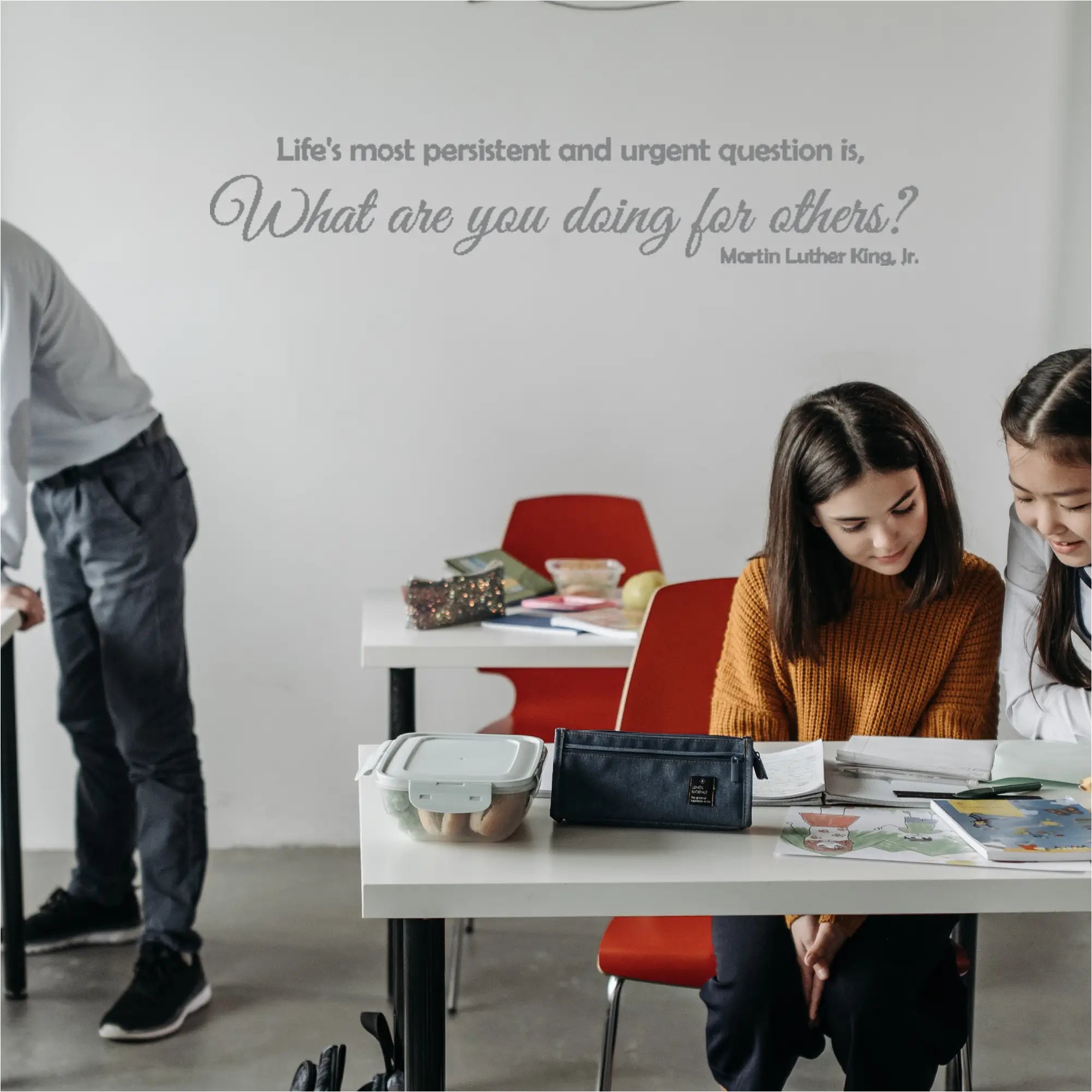 Empowering Grey MLK Wall Decal Enhancing School Classroom Ambiance with inspiring quote that reads: Life's most persistent and urgent question is, "What are you doing for others?" -Martin Luther King, Jr. Design by The Simple Stencil