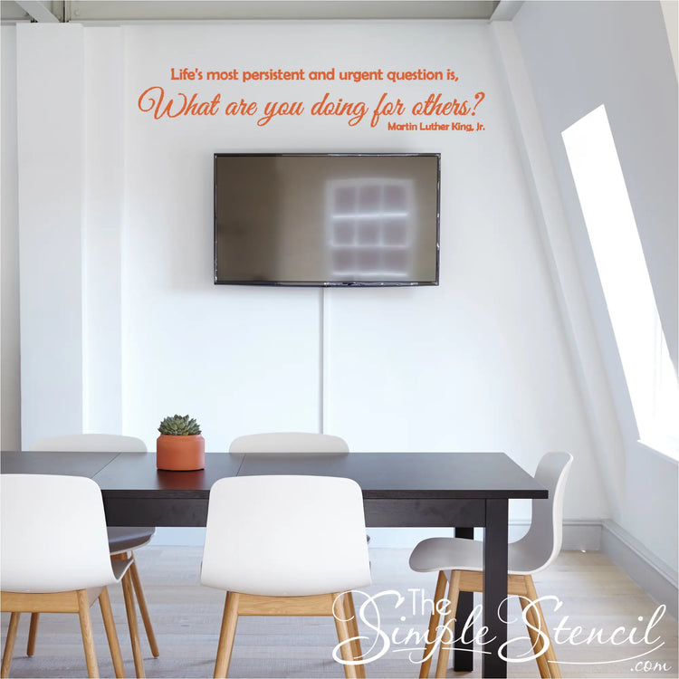 Inspiring Orange MLK Quote Wall Decal in Professional Office Setting where the quote reads: Life's most persistent and urgent question is, "What are you doing for others?" Martin Luther King, Jr. Design by The Simple Stencil
