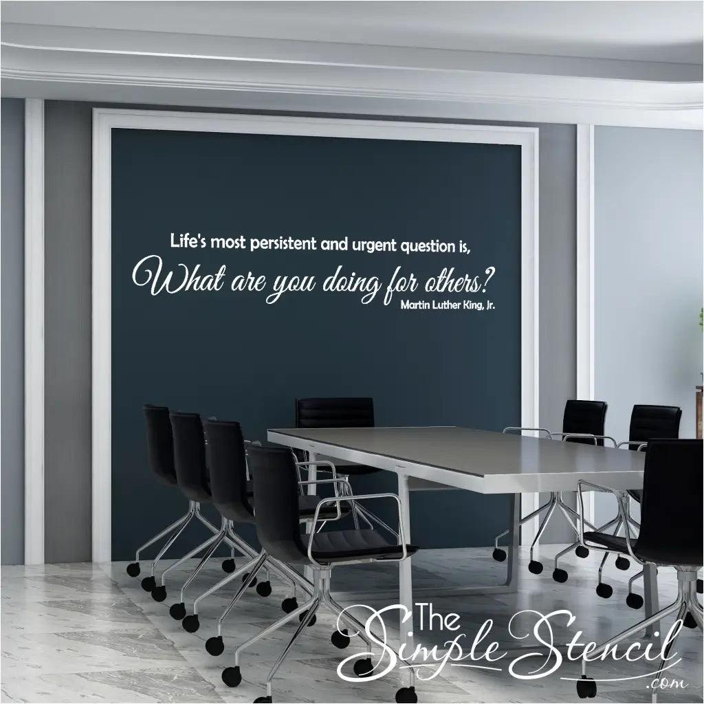 Contrast and Inspiration – White MLK Quote Wall Decal on Dark Office Wall MLK Quote reads: Life's most persistent and urgent question is, "What are you doing for others?" -Martin Luther King, Jr. Design by The Simple Stencil
