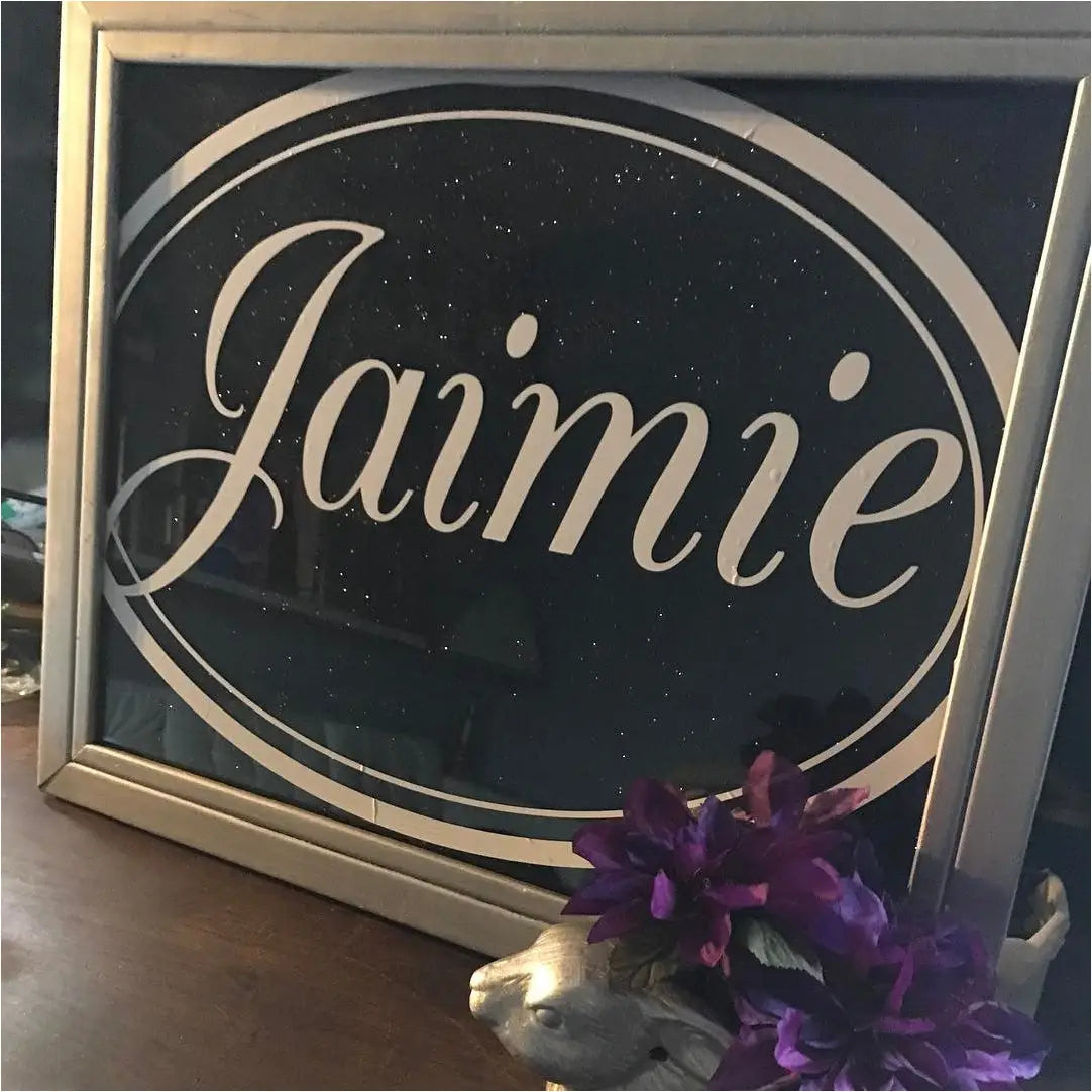 Customer supplied picture of their monogram installed on glass picture frame. Custom monogram decals by TheSimpleStencil.com