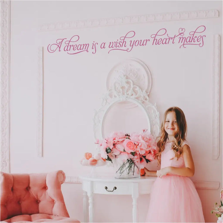Beautiful girls playroom area for princess themed rooms and parties, wall decal reads A dream is a wish your heart makes by TheSimpleStencil