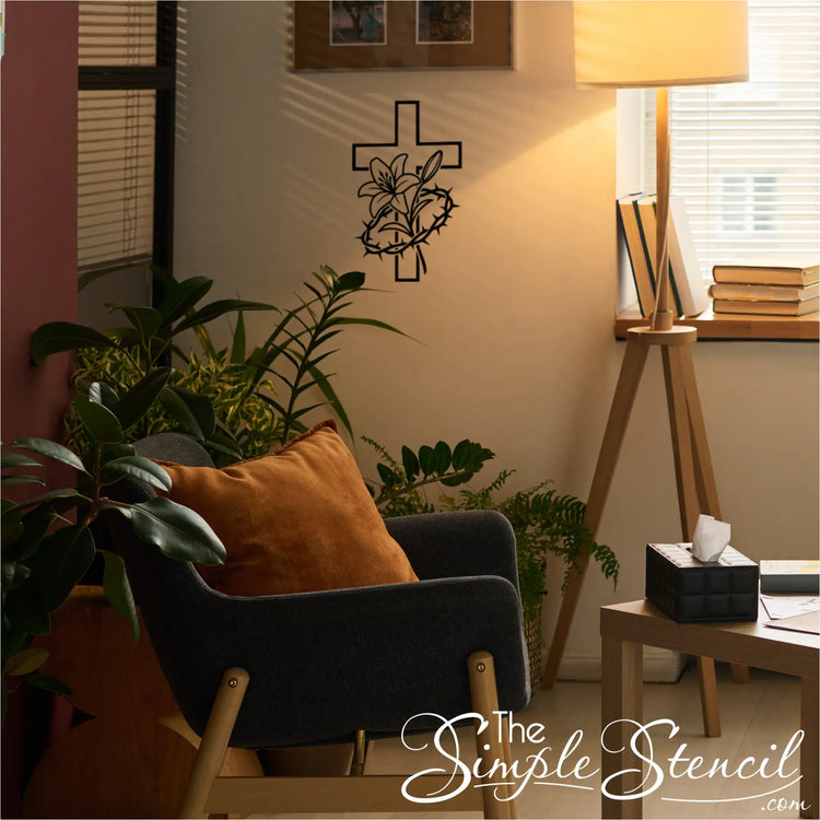 Living room with a chair, lamp, and wall decal of a cross with flowers.