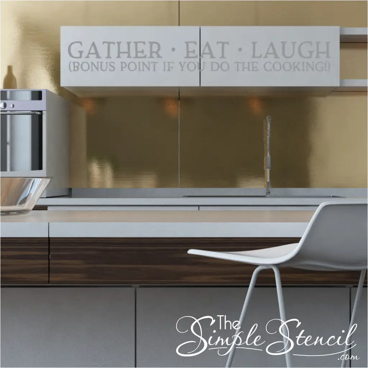 Playful kitchen wall decal featuring the humorous quote 'Eat Gather Laugh - Bonus Points If You Do The Cooking - By The Simple Stencil