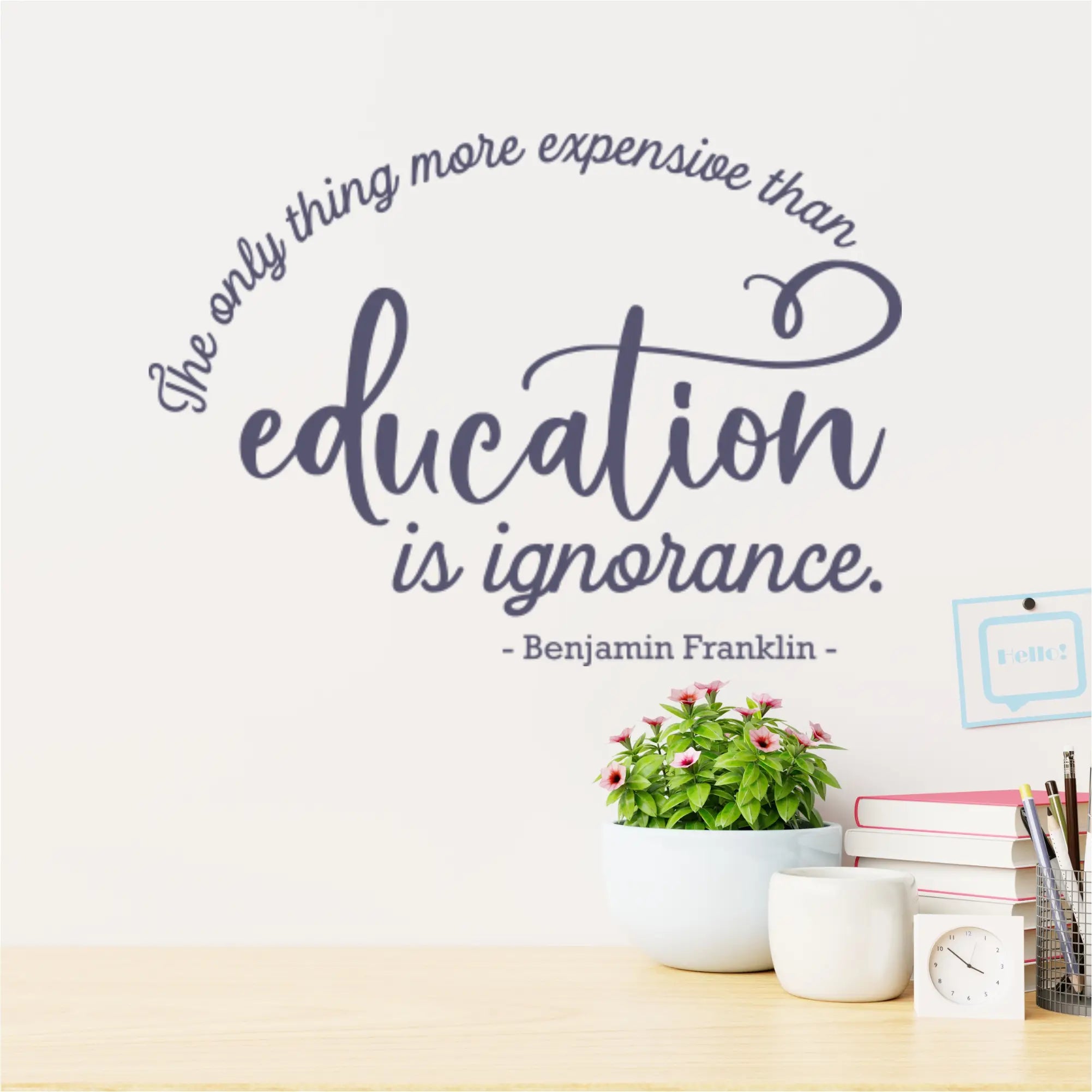 Wall decal with Benjamin Franklin quote in a teacher's lounge, providing daily inspiration.