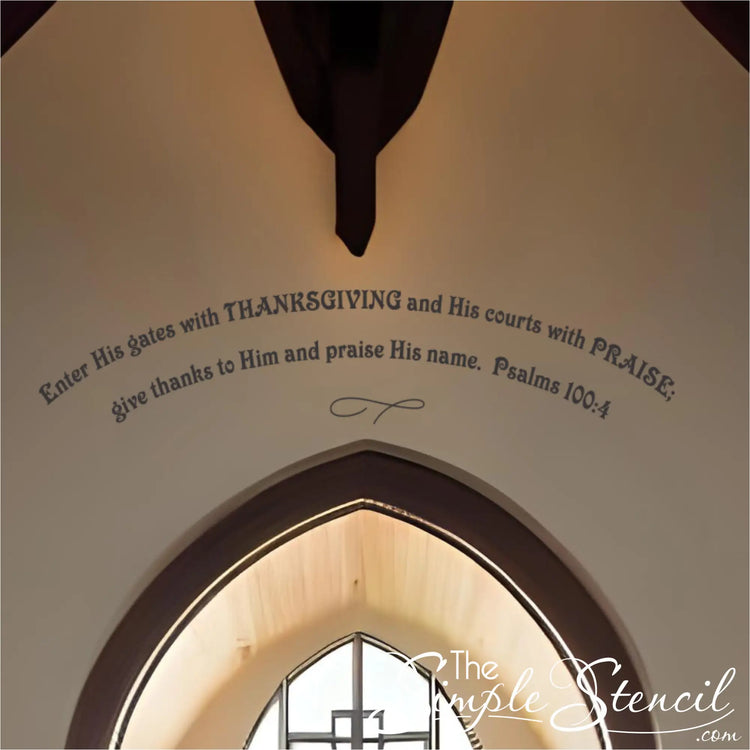 Close-up of a blush-colored scripture quote decal arched high on a church wall above a circular window and cross. Features the full text of Psalms 100:4 as powerful Thanksgiving religious decor.
