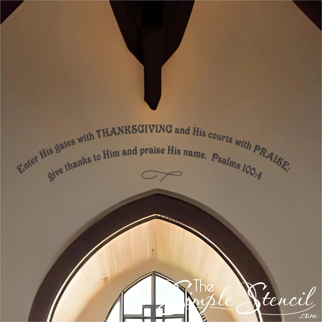 Close-up of a blush-colored scripture quote decal arched high on a church wall above a circular window and cross. Features the full text of Psalms 100:4 as powerful Thanksgiving religious decor.