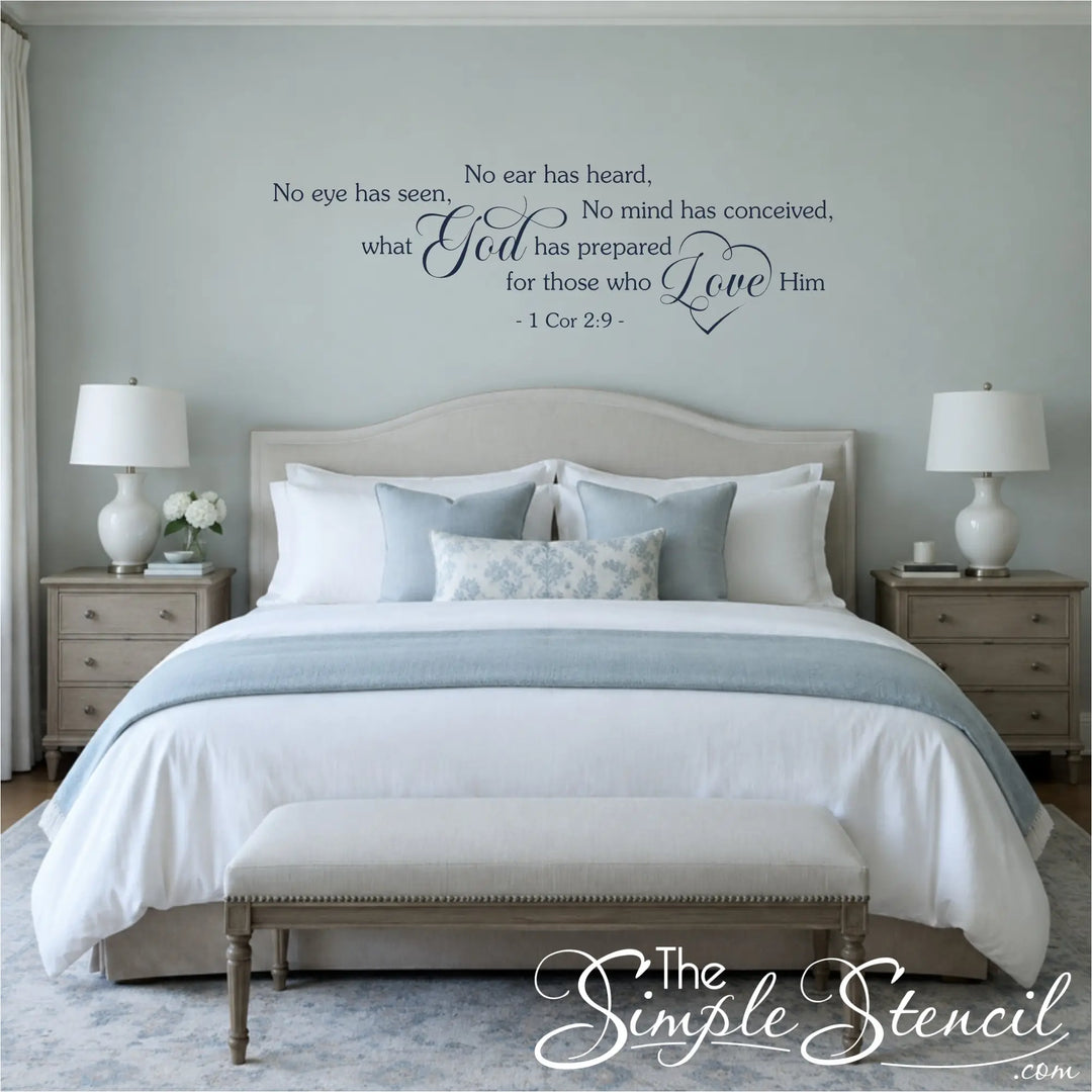 Navy blue No Eye Has Seen 1 Corinthians 2:9 Bible verse wall lettering centered above an upholstered headboard in a serene blue-gray master bedroom.