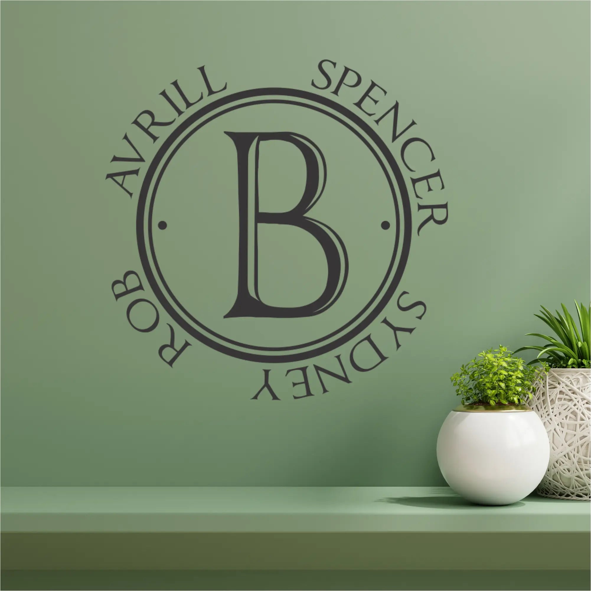 Family Initial with family members first names circling is a great wall decal to display in a family gathering room or playroom. Many sizes and beautiful colors available at The Simple Stencil