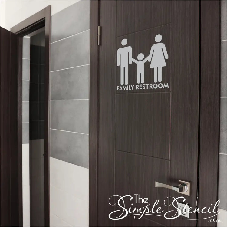 Close-up view of a self-adhesive vinyl family restroom decal sign applied to a door. The high-resolution design looks professionally painted on and features the family restroom symbol and text in clear, contrasting colors.