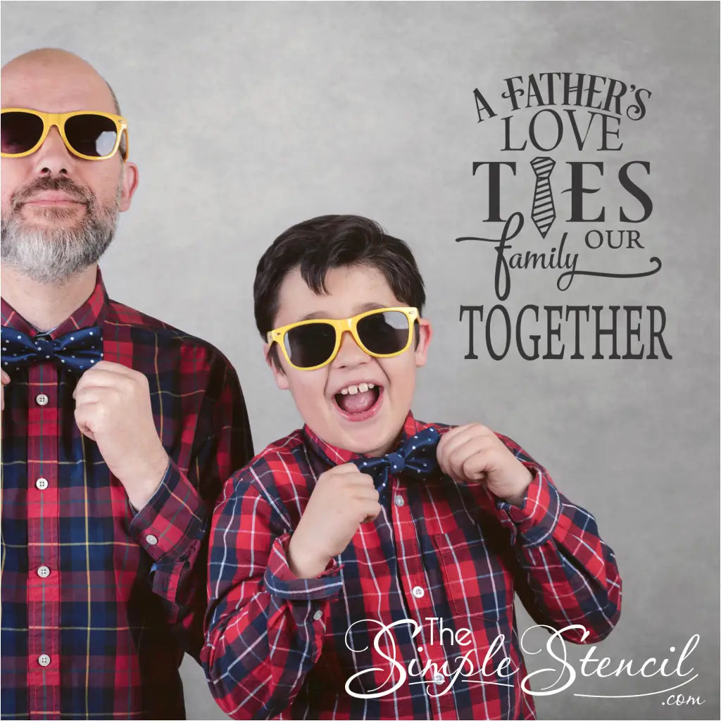 "A father's love ties our family together" Father's Day wall decal in a stylish font and graphic next to a father and son posing with their bowties. By The Simple Stencil