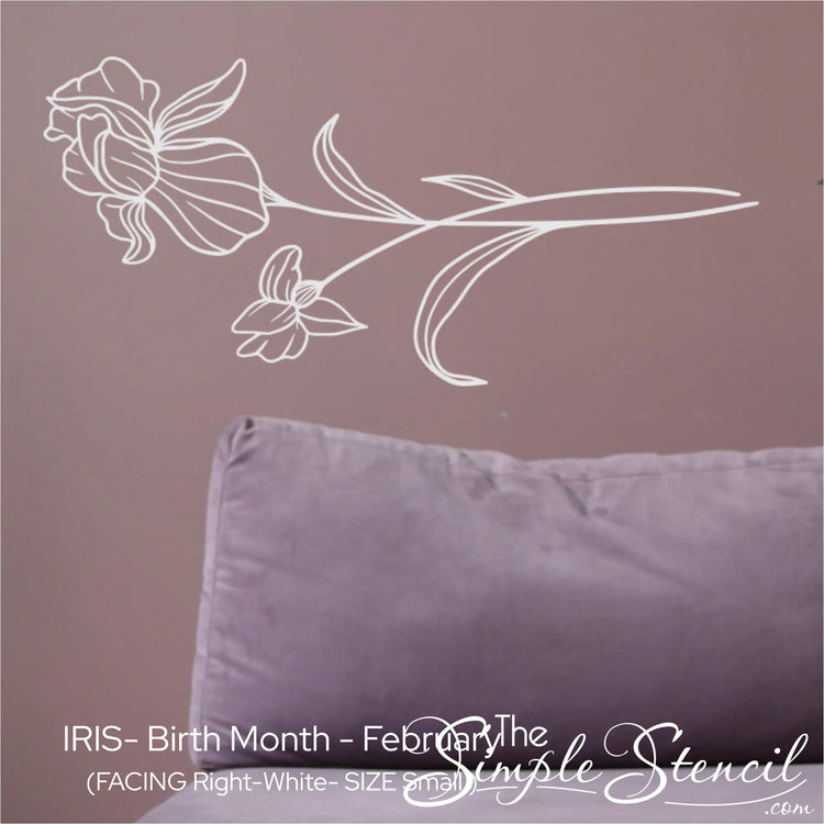 A small white Iris wall silhouette applied horizontally above a soft purple velvet sofa for a peaceful, modern contrast.