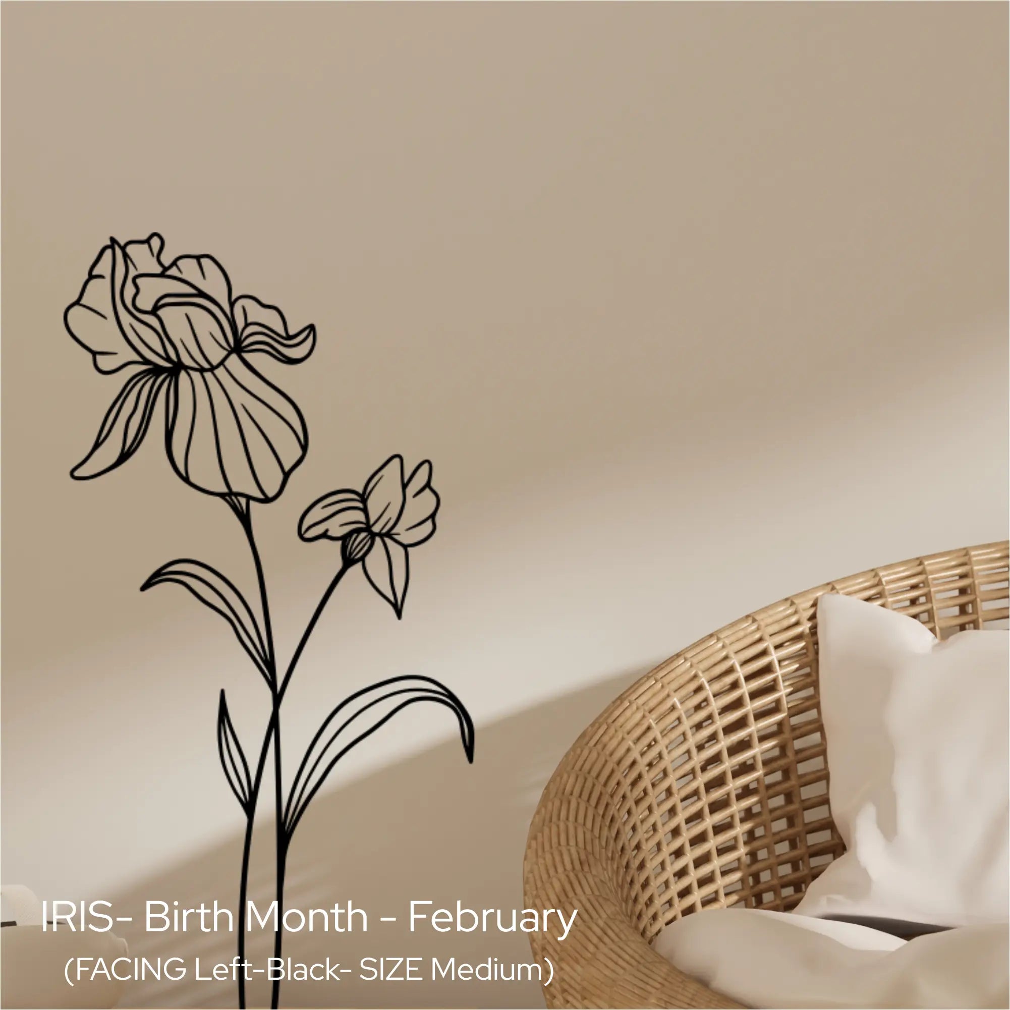 A black Iris birth flower wall silhouette applied vertically next to a natural wicker chair in a neutral, calm living room.