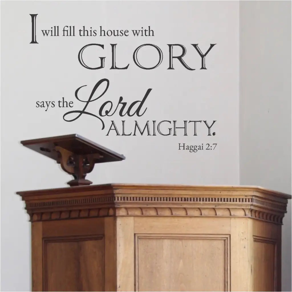 The "I Will Fill This House With Glory" wall decal displayed prominently on a church sanctuary wall.