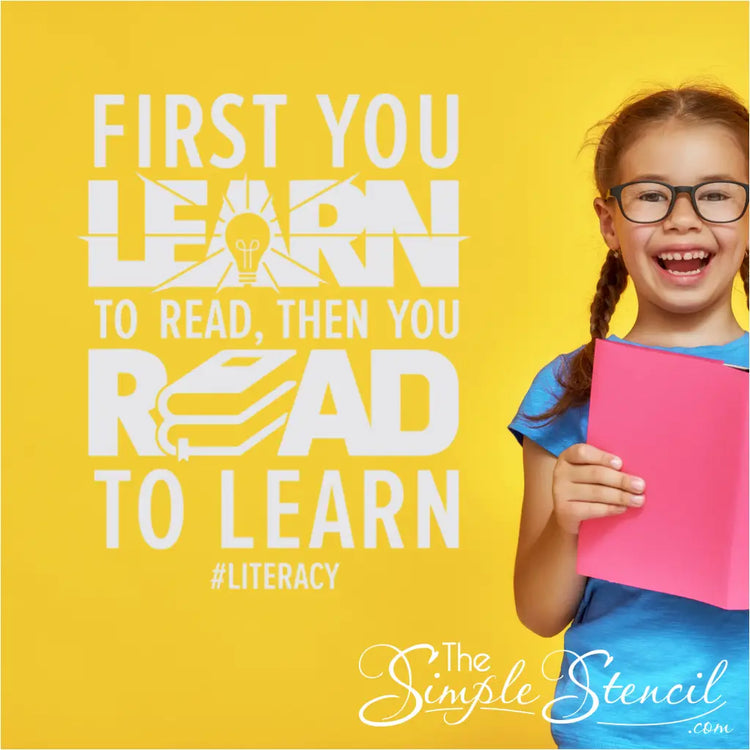 A student reading a book next to the "First you learn to read, then you read to learn" wall decal.