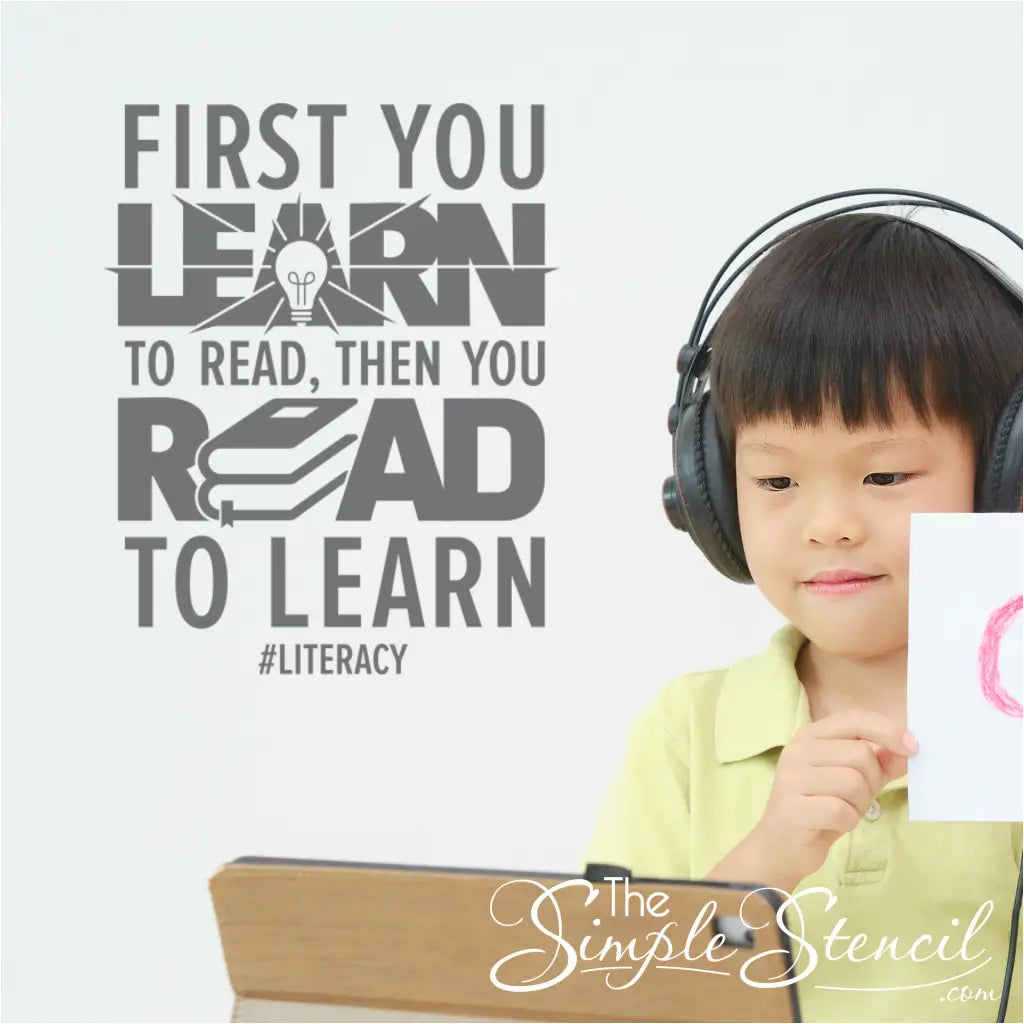 "First you learn to read" wall decal in a school classroom setting.