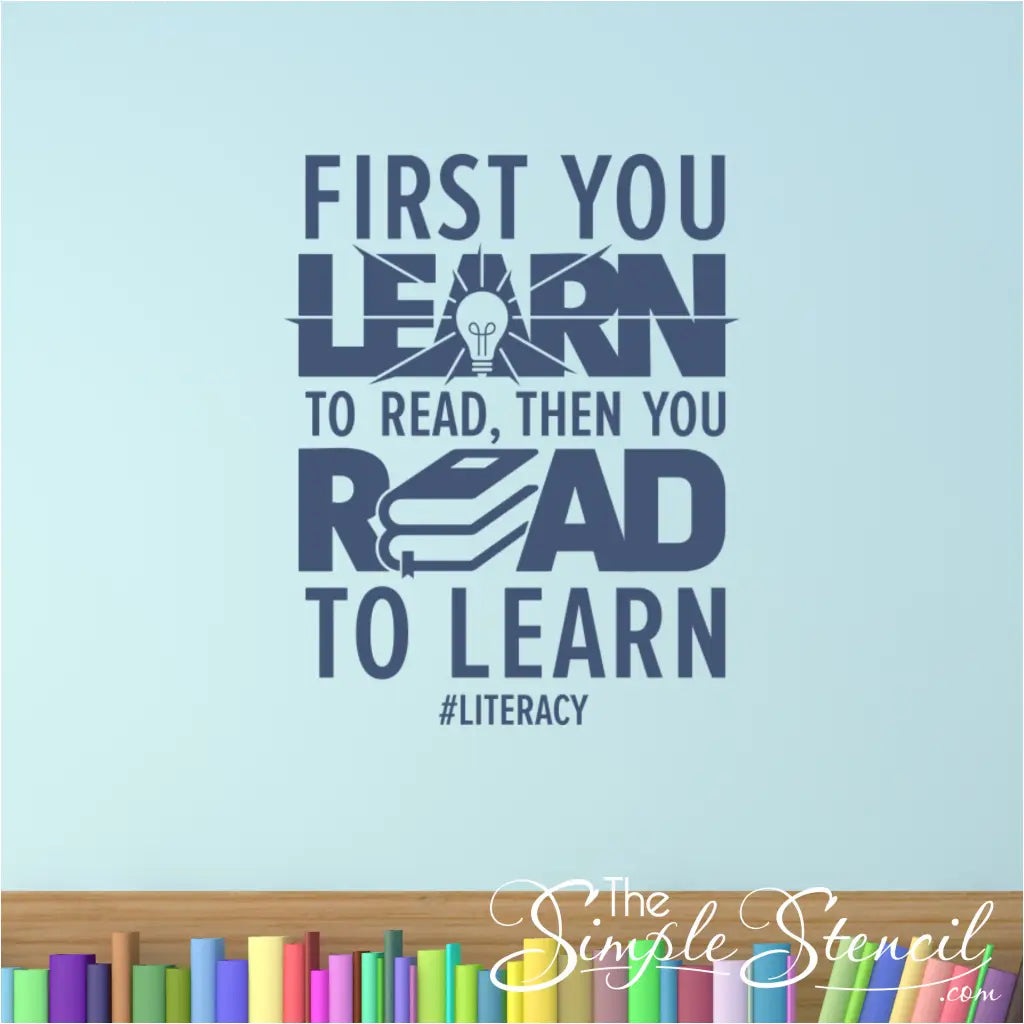 The "First you learn to read, then you read to learn" wall decal applied above a library reference section.