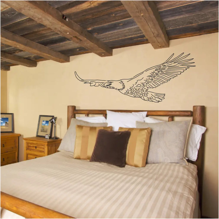 Flying eagle wall decal art by The Simple Stencil adds a rustic look to this farmhouse guestroom. 
