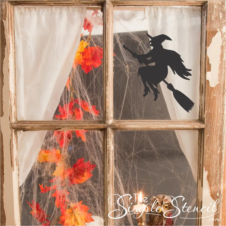 Flying Witch Decal Window: A silhouette of a witch flying on a broomstick, applied to a window for a spooky Halloween effect.