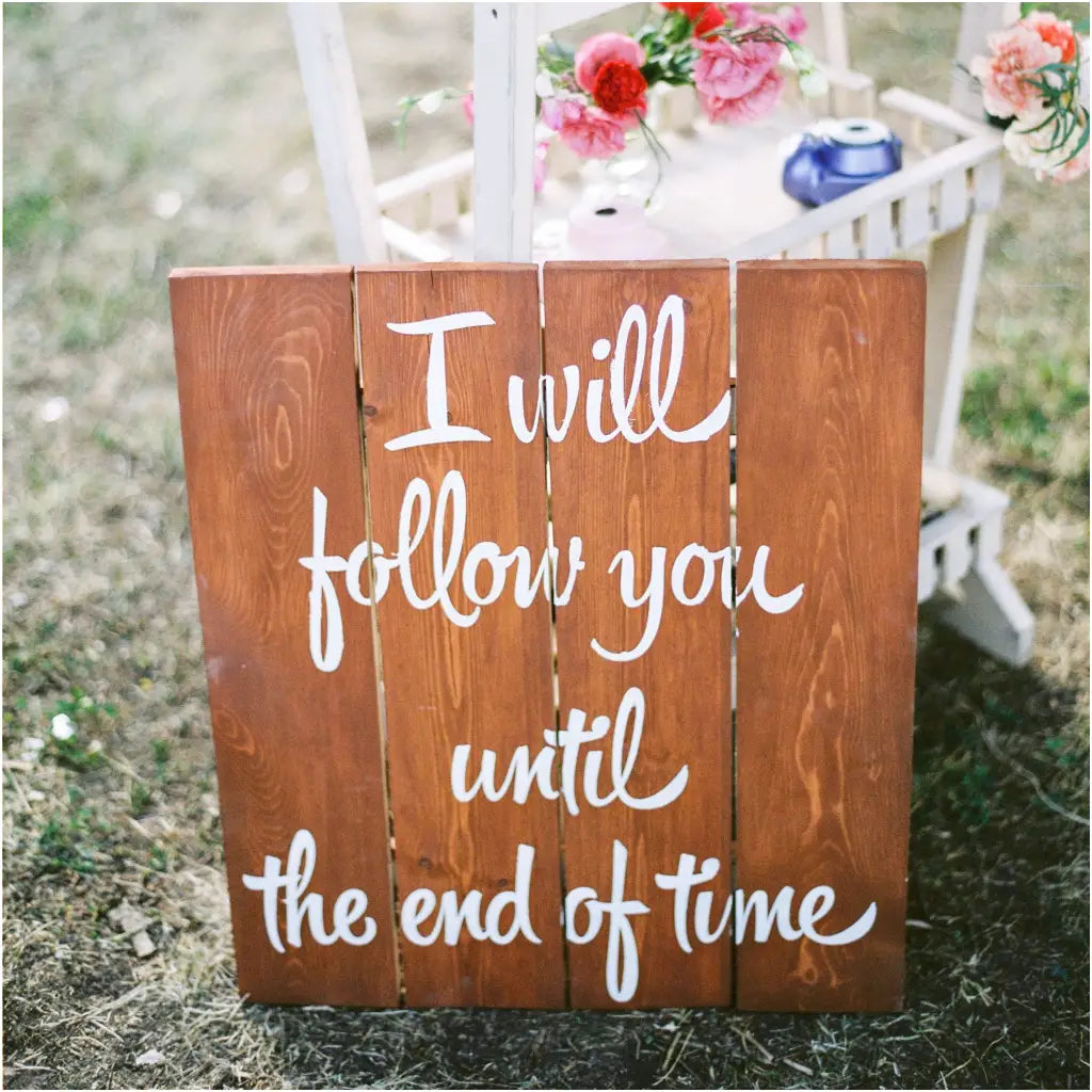 An adorable vinyl wall decal that was applied to wood planks to create a one of a kind sign to be given to any happy couple!