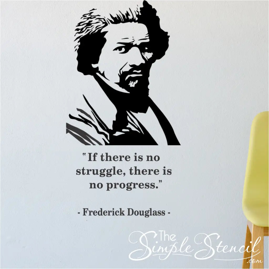 A large Frederick Douglass silhouette and quote decal installed as a feature wall above a yellow chair in a modern space.