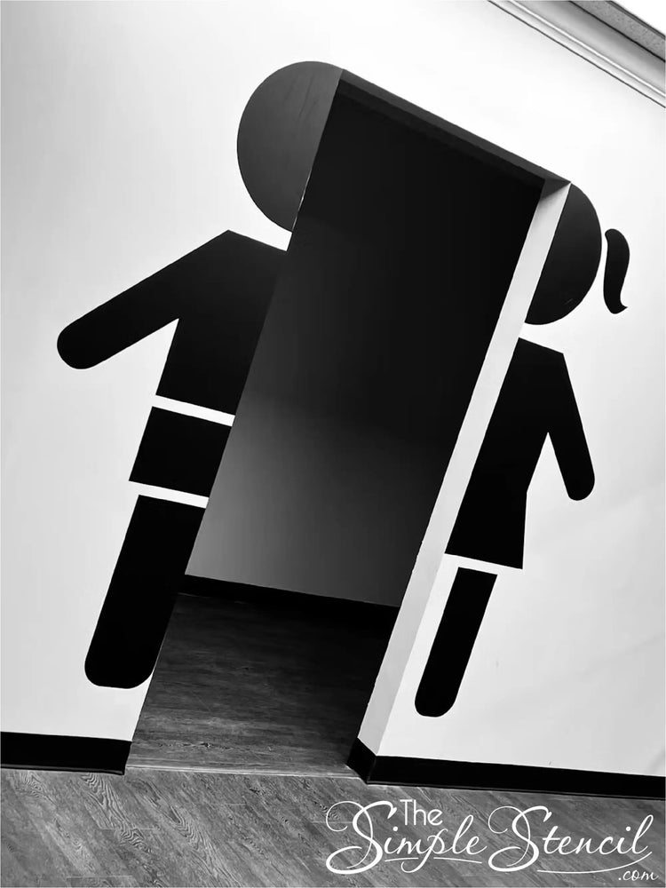 Customer Supplied picture of Boy and Girl Restroom Sign Decals installed on walls leading to restrooms - Design and decals supplied by The Simple Stencil