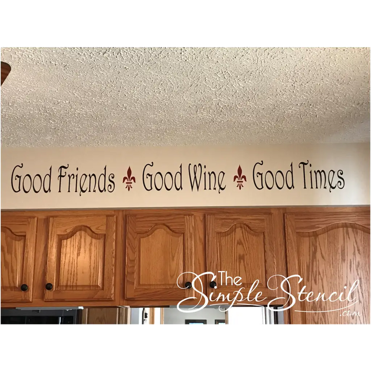 customer supplied picture of their wall decal by The Simple Stencil on their kitchen soffit reads: Good friends, Good wine, Good times. 