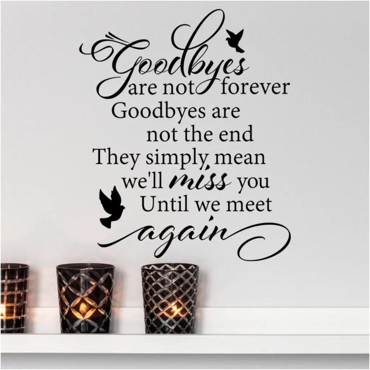Goodbyes Are Not Forever | Memorial Picture Wall Quote Decal | Shown applied to a wall over a set of lit candles and looks beautiful in a place it can be looked upon often to remind of our lost loved ones in a positive way. 