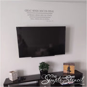 A picture of Eleanor Roosevelt's quote applied to a wall over a television in a family room. Decal reads: Great minds discuss ideas, average minds discuss events. Small minds discuss people. 