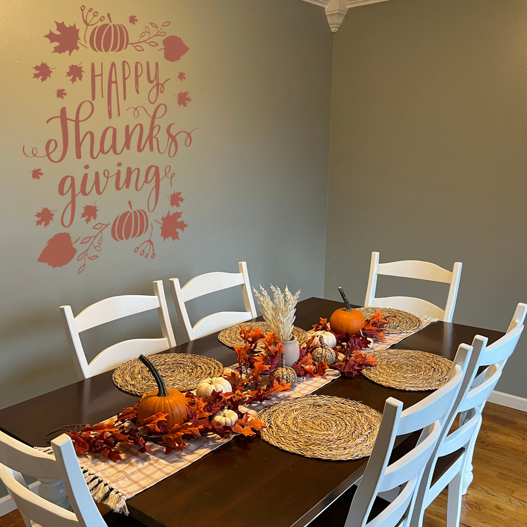 A dining room set for Thanksgiving dinner with a dark table and white chairs. Thanksgiving wall decal displayed beautifully over a dining room or gathering area.