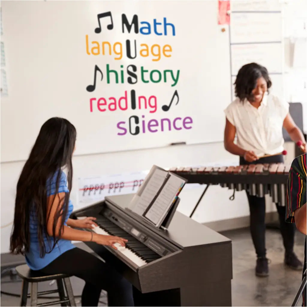 "MUSIC Subjects" wall decal in vibrant colors adorns an elementary classroom, showcasing how math, language, history, reading, and science connect through music, fostering a love for learning in young minds.
