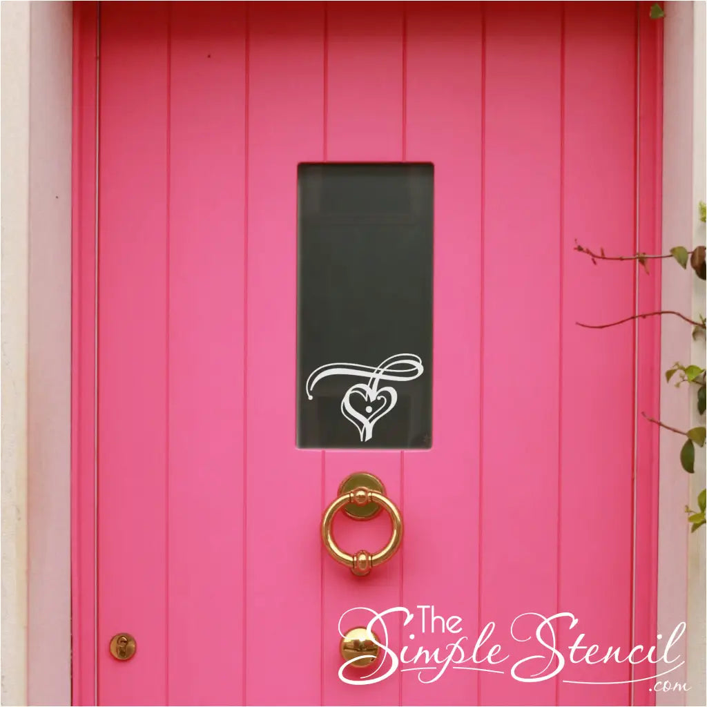 heart flourish decal on window of pink door for valentine's day decor