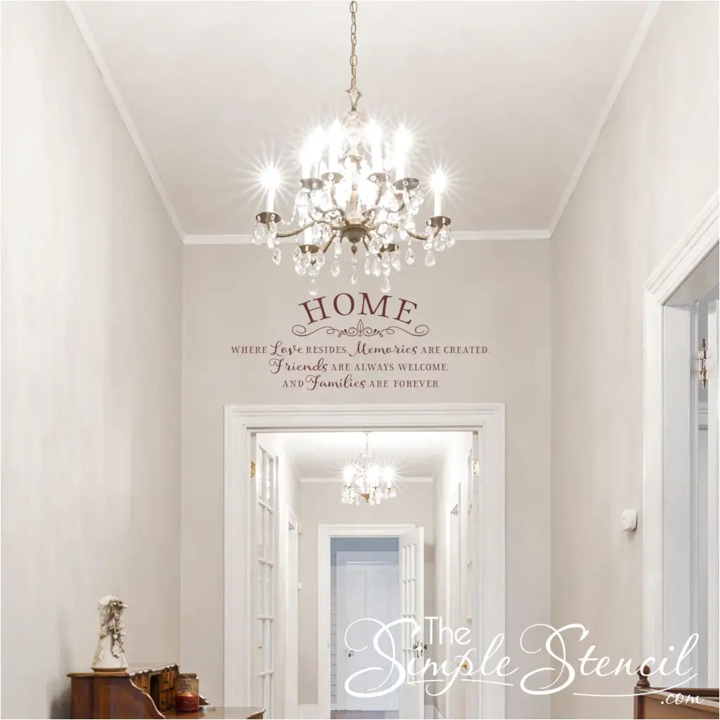 Foyer Entryway Decor with a Home Where Love Resides Quote Decal and Crystal Chandelier