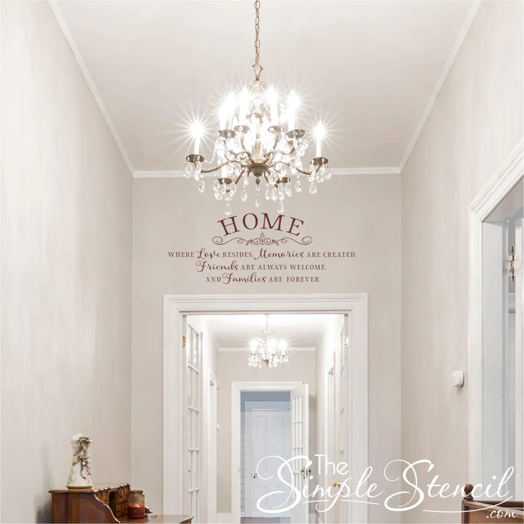 Foyer Entryway Decor with a Home Where Love Resides Quote Decal and Crystal Chandelier