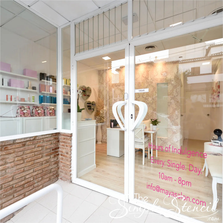 Close-up of a "Hours of Indulgence" decal seamlessly integrated into a salon's window design, adding a touch of humor. By The Simple Stencil