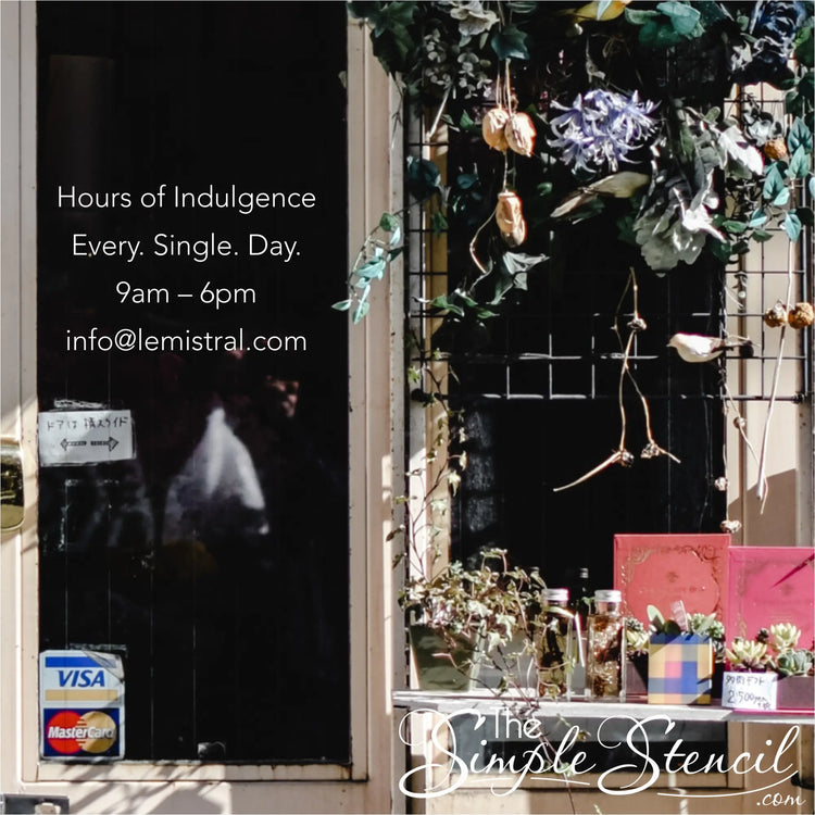 Charming boutique window showcasing a playful "Hours of Indulgence: Every. Single. Day." vinyl decal alongside colorful displays, inviting customers to step in and explore. By The Simple Stencil