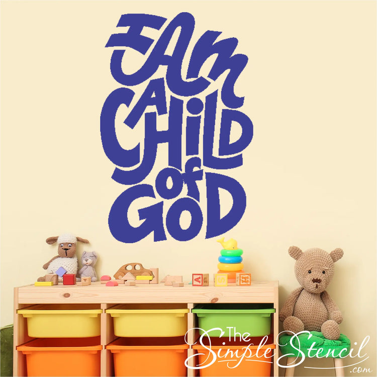 Large blue vinyl decal with colorful text reading "I Am A Child of God" displayed on a light yellow church nursery wall.