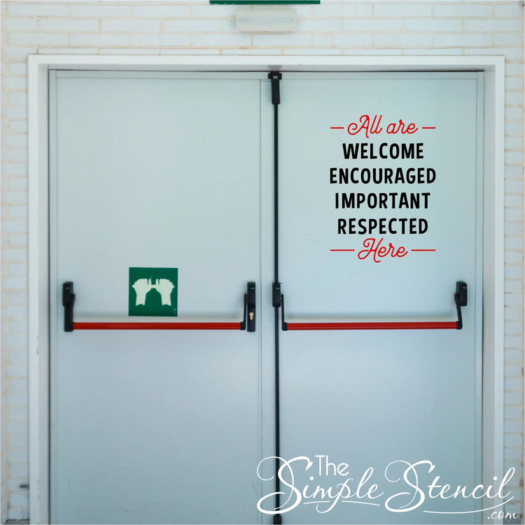 A removable decal with the phrase "All are welcome, encouraged, important, respected here" in bold, colorful letters applied to a school entrance doorway to welcome all students.