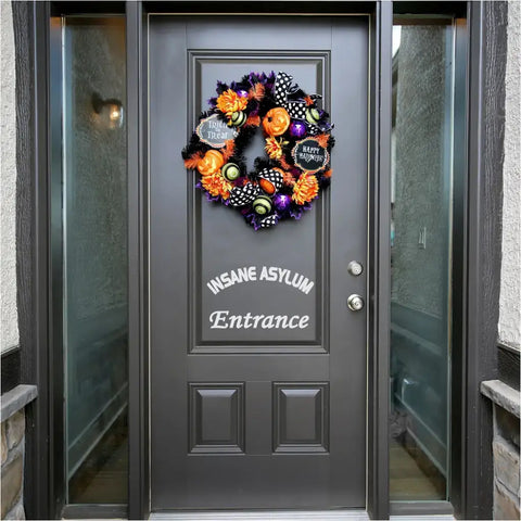Insane Asylum Entrance Decal used as Halloween decor to create a simple stylish way to welcome trick or treaters that's minimalistic but spooky!