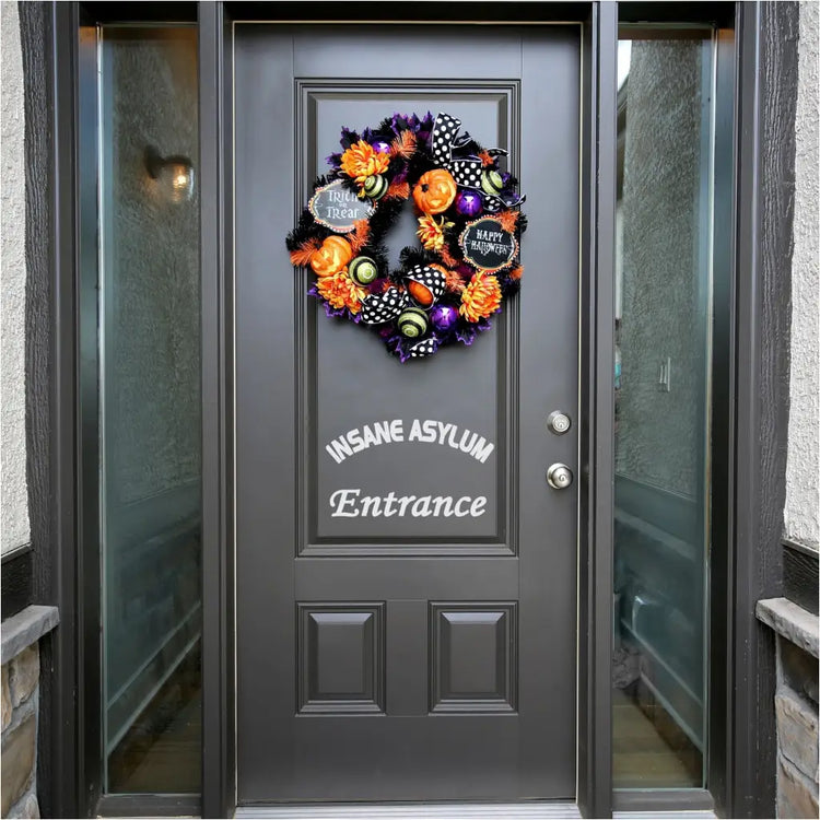 Insane Asylum Entrance Decal used as Halloween decor to create a simple stylish way to welcome trick or treaters that's minimalistic but spooky!