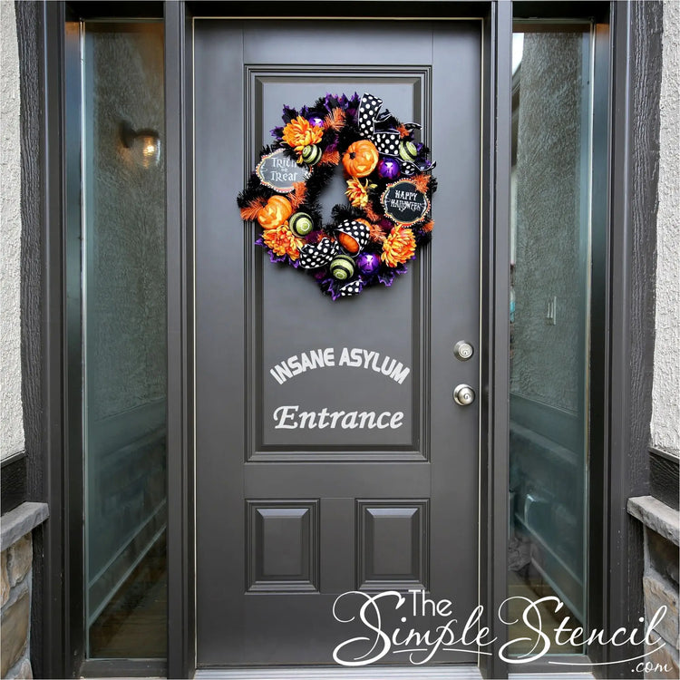 Insane Asylum Entrance Decal used as Halloween decor to create a simple stylish way to welcome trick or treaters that's minimalistic but spooky!
