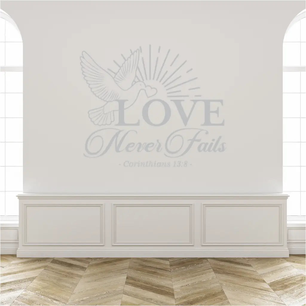 Large Bible Verse wall decal shown on a church wall for as a temporary wedding decoration that reads: Love Never Fails and features a flying dove with a heart in it's beak. By The Simple Stencil