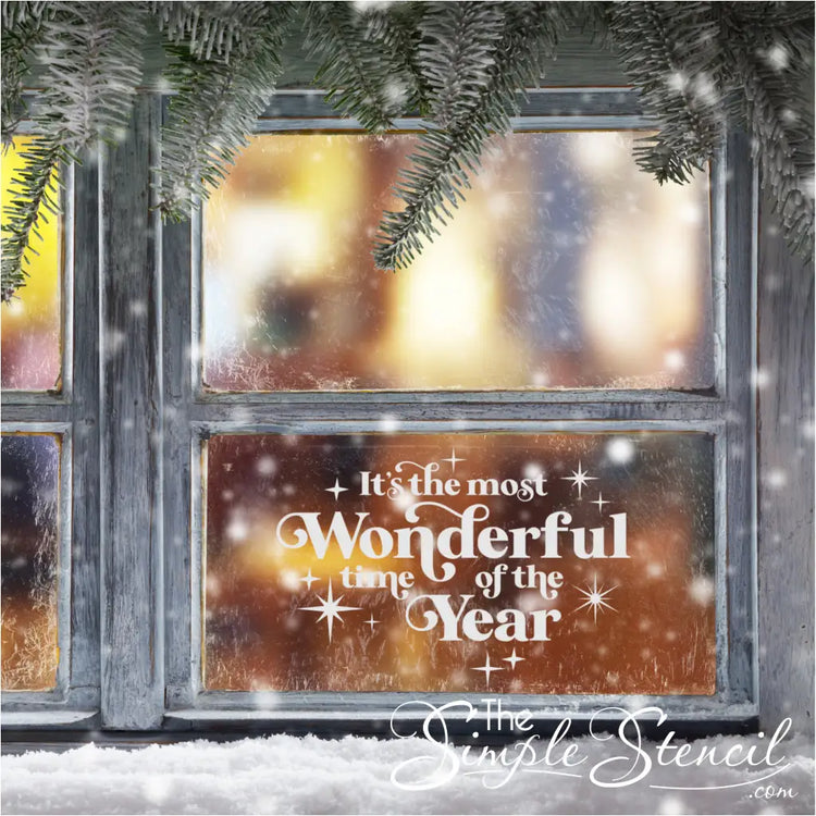 White Christmas decal 'It's the Most Wonderful Time of the Year' on a window, surrounded by festive snow. Creates a welcoming entryway that's festive.