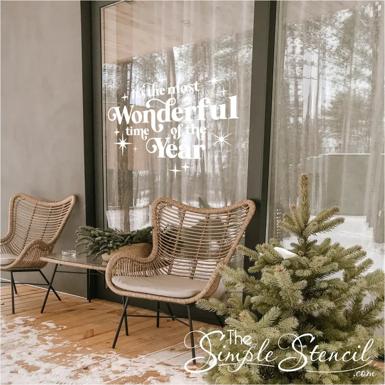 Large white vinyl window decal featuring 'It's the Most Wonderful Time of the Year' script. Ideal for home porch windows, glass doors, or small business storefront window displays to attract holiday shoppers. Weather-resistant Christmas sign.