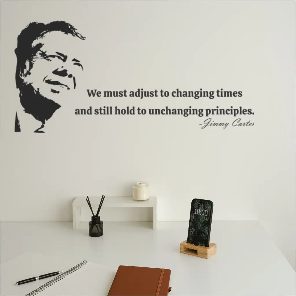 Black silhouette decal of President Jimmy Carter and the quote 'We must adjust to changing times and still hold to unchanging principles.