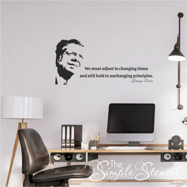 A Jimmy Carter wall decal, featuring his silhouette and the quote 'We must adjust to changing times and still hold to unchanging principles,' applied to a white wall.