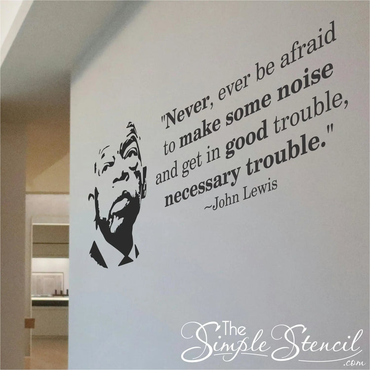 A modern government office hallway featuring the John Lewis Good Trouble vinyl wall decal.