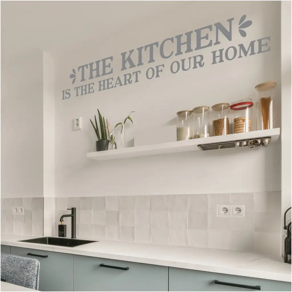 Inspirational kitchen wall decal featuring the quote 'The Kitchen is the Heart of Our Home' by The Simple Stencil