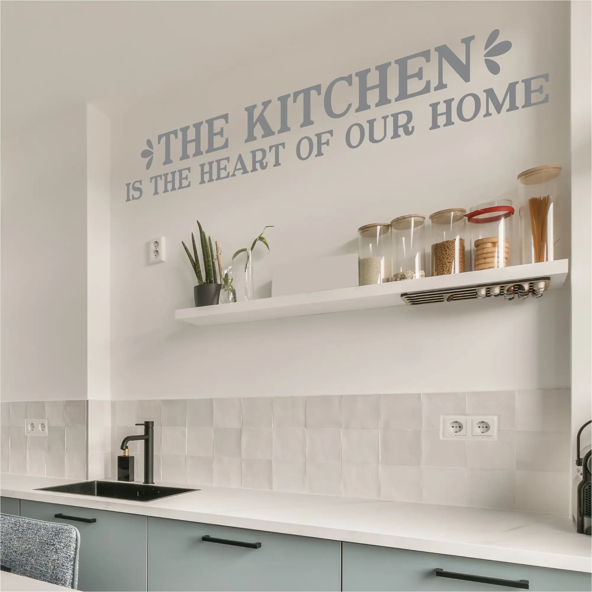 Inspirational kitchen wall decal featuring the quote 'The Kitchen is the Heart of Our Home' by The Simple Stencil