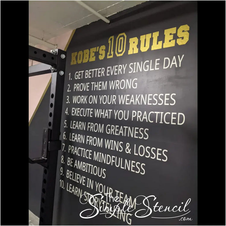 Customer provided picture of Kobe's 10 rules displayed on her fitness center walls using white and gold vinyl decals