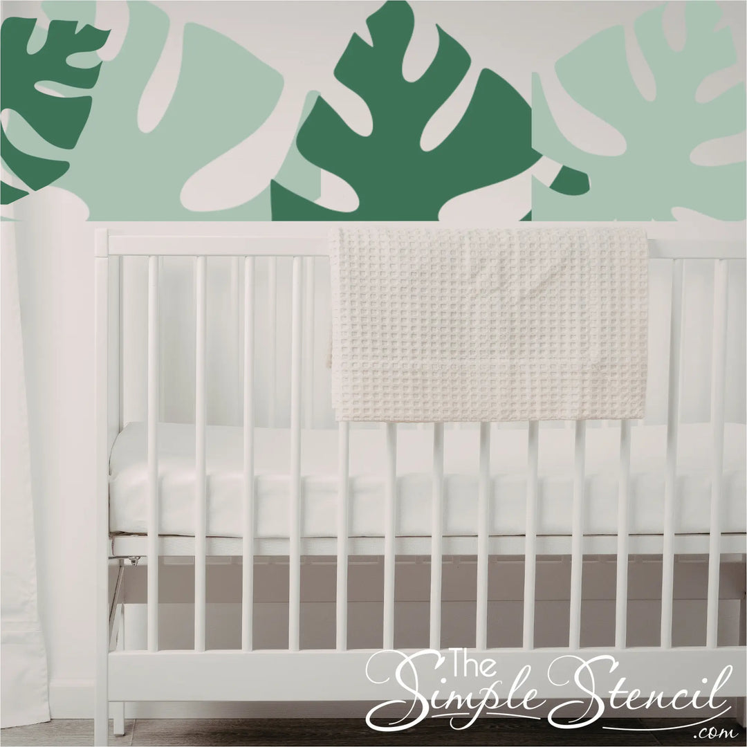 monstera-leaf-cluster-wall-decals-over-white-crib-green-shades